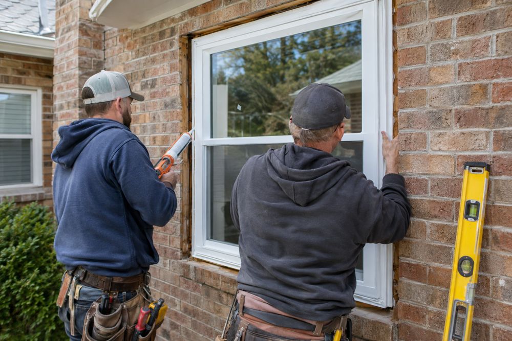 Installers setting a new replacement window